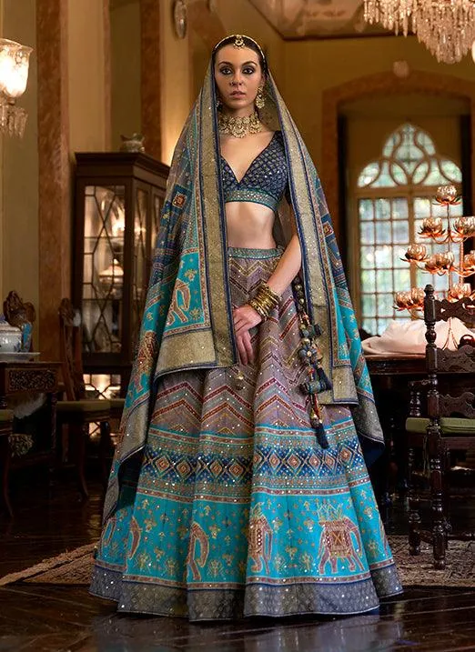 Affectionate Blue Bridal Lehenga Choli with Sparkle & Mirror Work in Smooth Rajwadi Silk